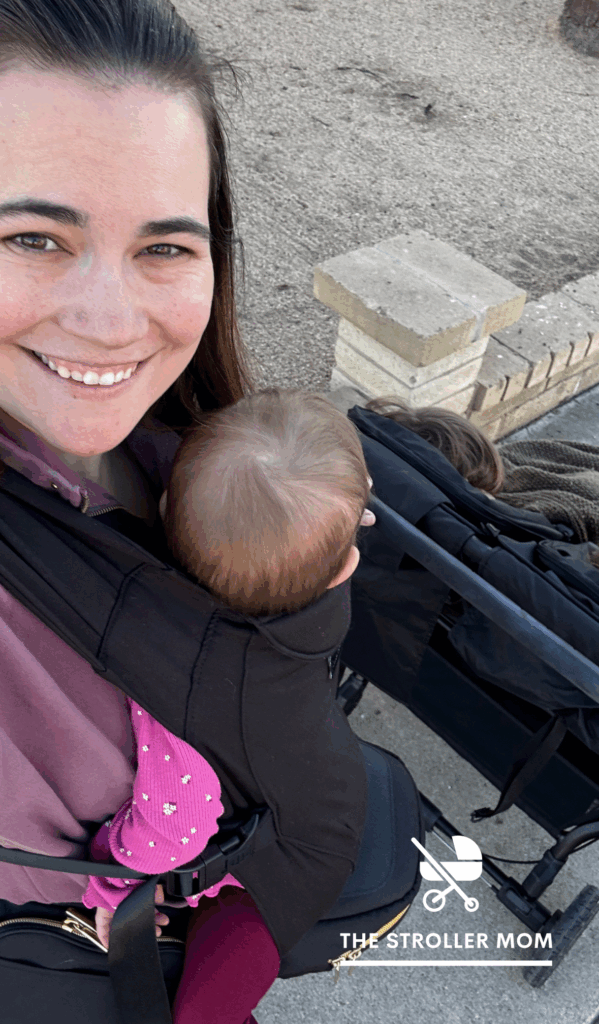 Baby wearing pushing a stroller